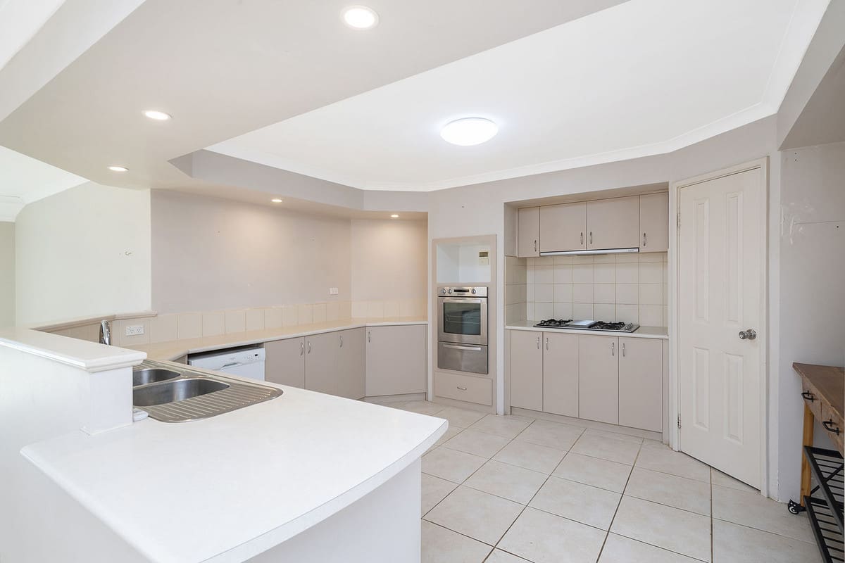 Spacious, modern kitchen with appliances.