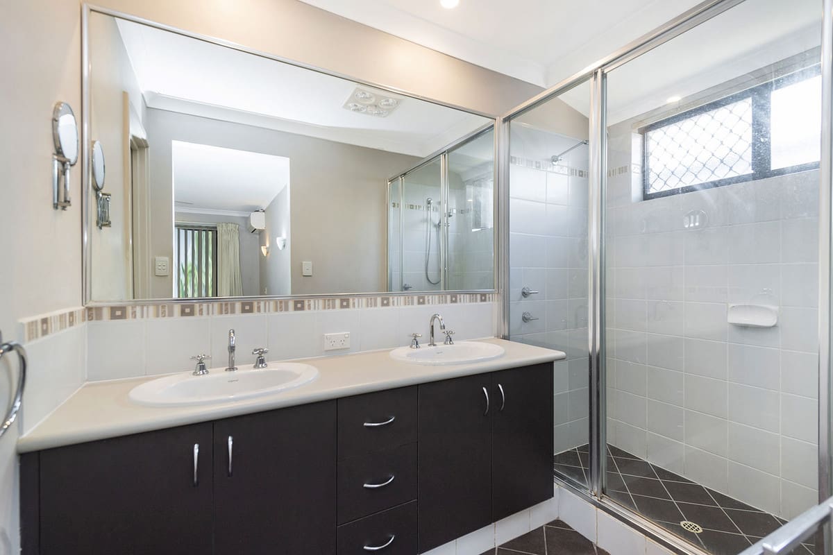 Spacious modern bathroom with double sinks.