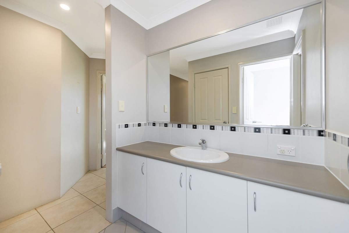Modern bathroom with large mirror