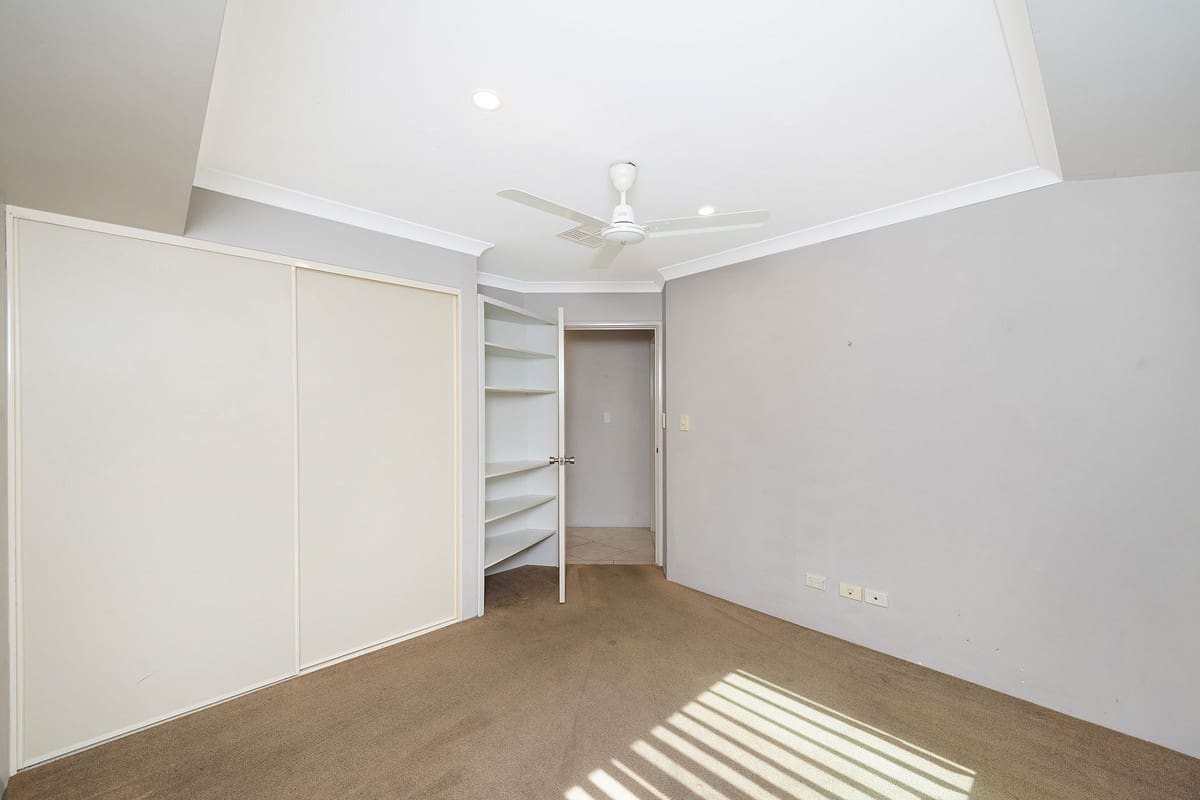 Spacious room with built-in wardrobe.